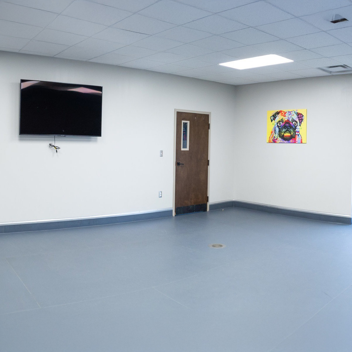 A playroom with a bright painting on the wall